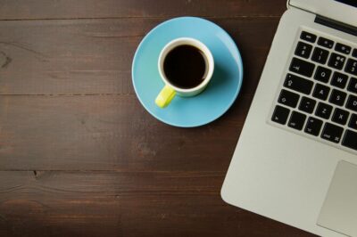 black-coffee-laptop-macbook-wood-table-desk-cup-saucer-isorepublic-thumb-1